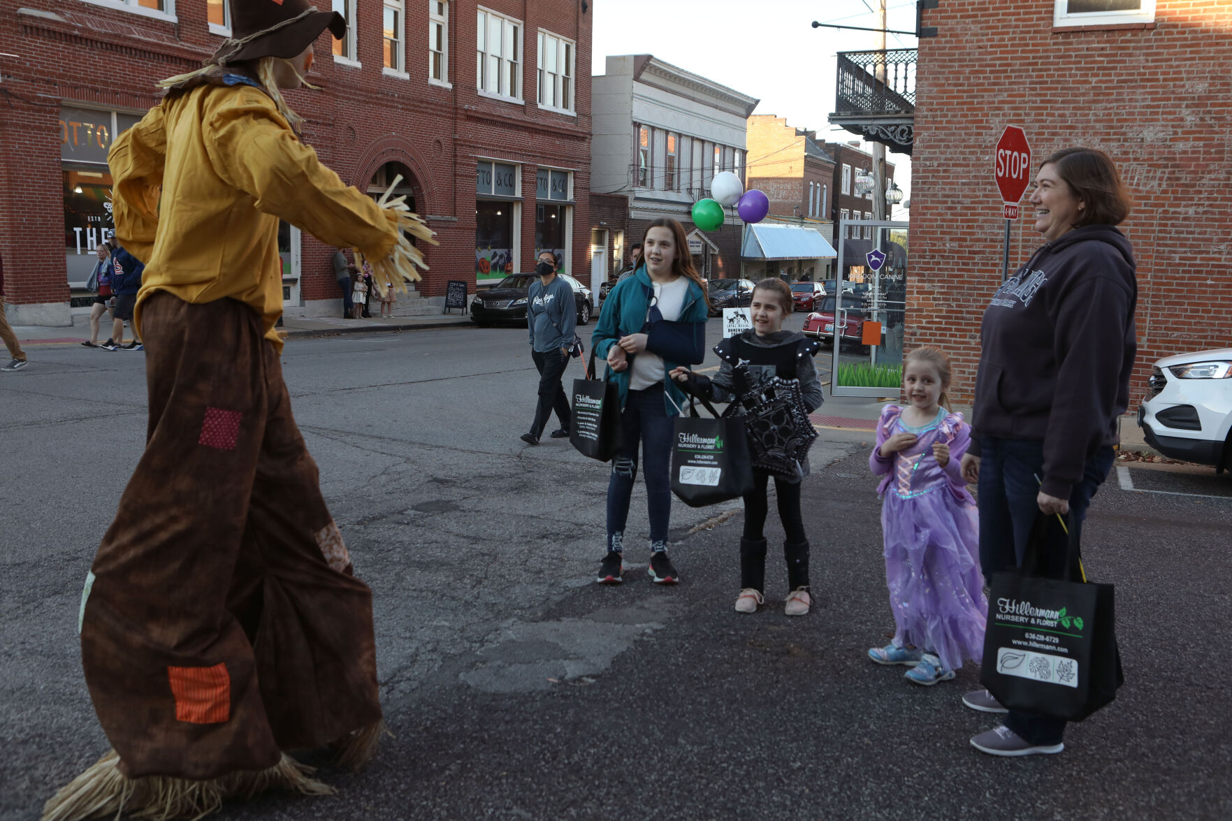 Alaina, Audrey, Adrienne and Alicia talk to a Scarecrow